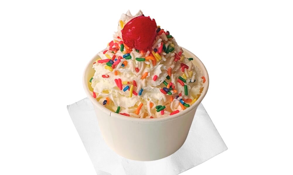 Larry's Homemade Ice Cream Sundae with Rainbow Sprinkles, Whipped Cream, and a Cherry